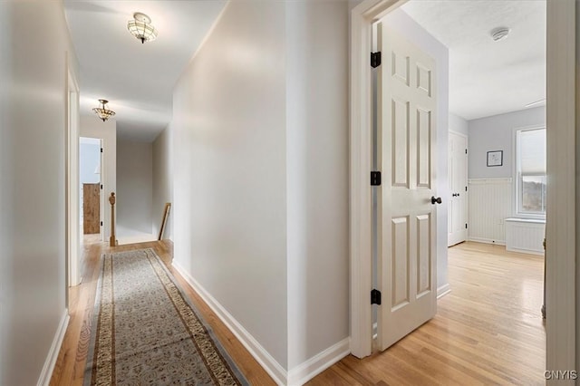 hall with light hardwood / wood-style floors