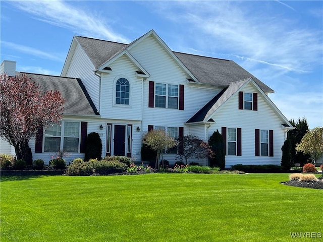 view of property featuring a front yard