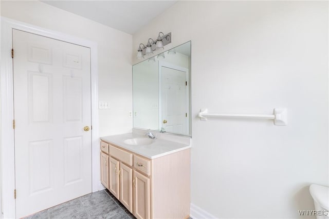 bathroom featuring tile patterned flooring and vanity