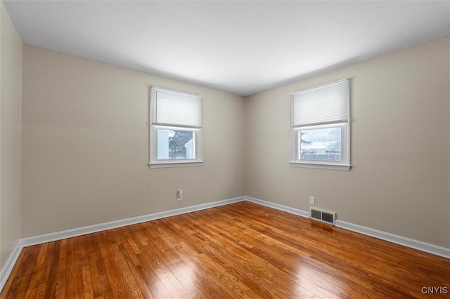 empty room with wood-type flooring