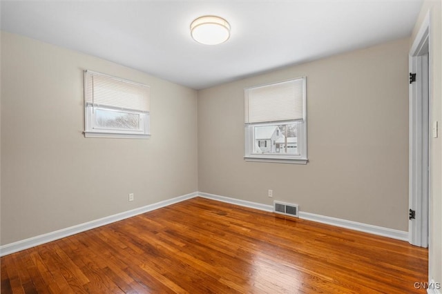 unfurnished room featuring hardwood / wood-style floors