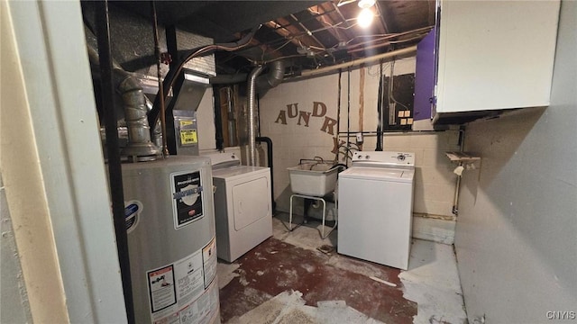 clothes washing area featuring cabinets, independent washer and dryer, sink, and water heater