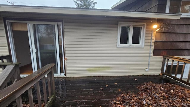 view of side of home with a wooden deck