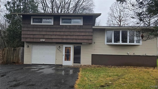 split level home featuring a garage