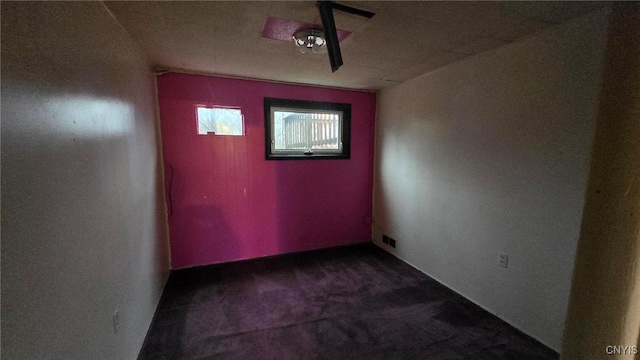 unfurnished room featuring carpet flooring