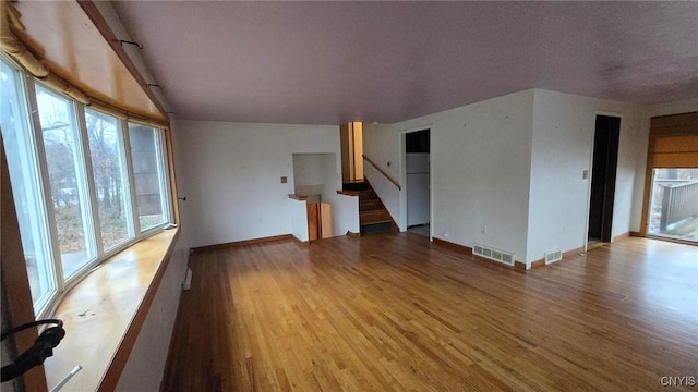 unfurnished living room featuring light hardwood / wood-style flooring