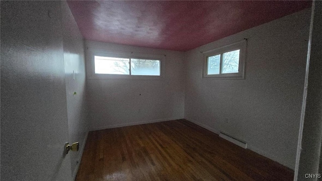 unfurnished room featuring hardwood / wood-style flooring