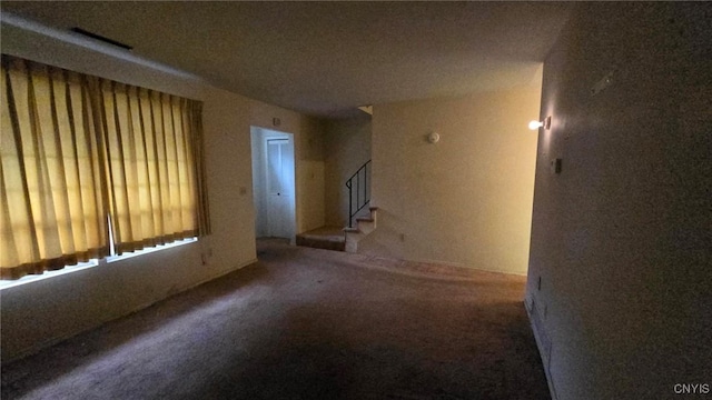 unfurnished room with carpet floors