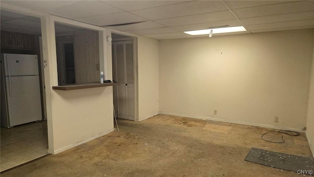 interior space featuring a paneled ceiling