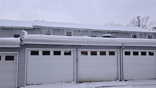 view of snow covered garage