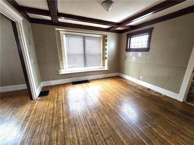 unfurnished bedroom with dark hardwood / wood-style flooring, beamed ceiling, and coffered ceiling