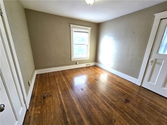 unfurnished room featuring hardwood / wood-style floors