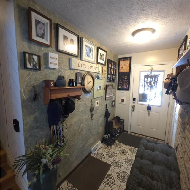 interior space featuring a textured ceiling