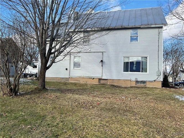 view of property exterior featuring a lawn