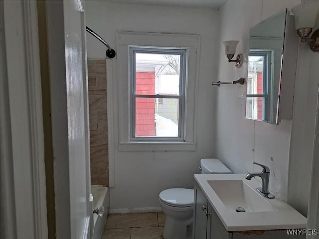 full bath featuring baseboards, vanity, and toilet