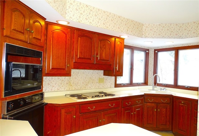 kitchen featuring black appliances and sink