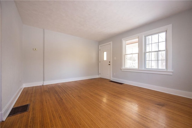 unfurnished room featuring wood-type flooring