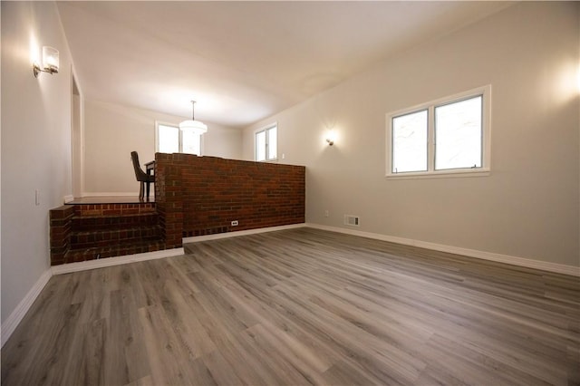 empty room featuring wood-type flooring