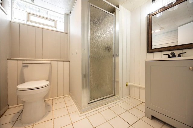 bathroom with tile patterned floors, vanity, and an enclosed shower