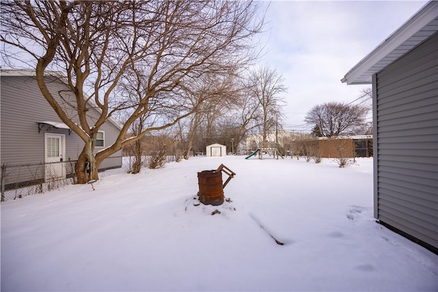 view of yard layered in snow