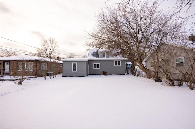 view of snow covered house