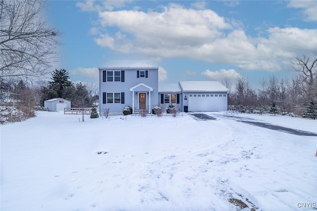 view of front of home featuring a garage and a storage unit