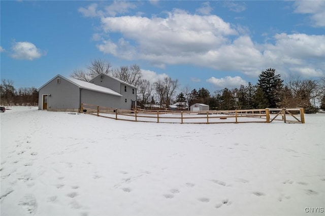 snowy yard with an outdoor structure