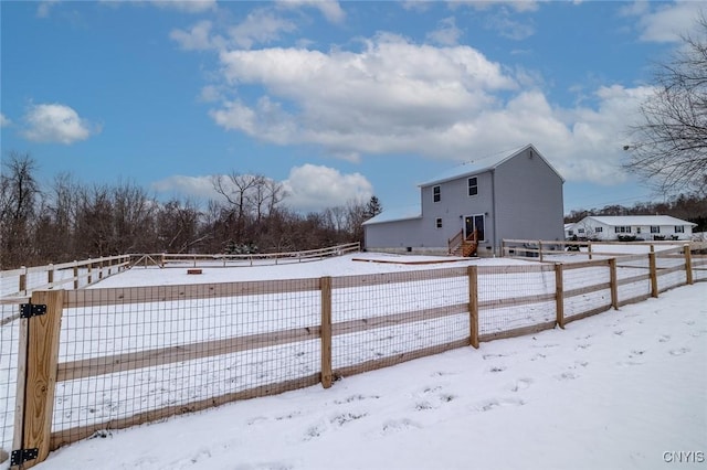 view of yard layered in snow