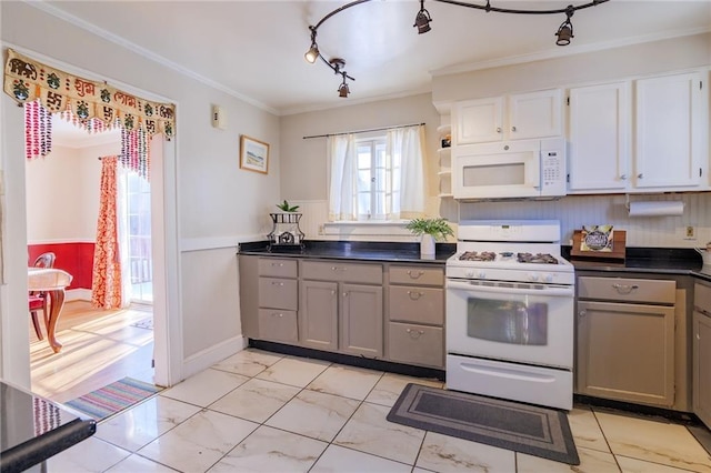 kitchen with gray cabinetry, white cabinets, white appliances, and ornamental molding