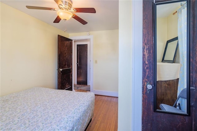 bedroom featuring ceiling fan and hardwood / wood-style flooring