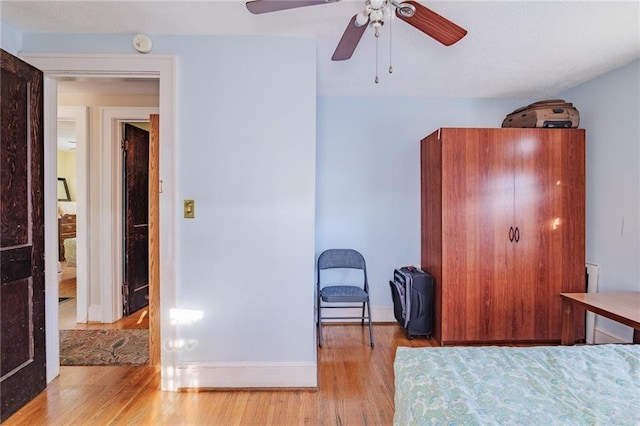 unfurnished bedroom featuring light hardwood / wood-style flooring and ceiling fan