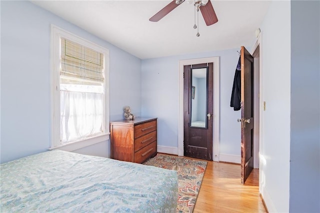 bedroom featuring ceiling fan and light hardwood / wood-style floors