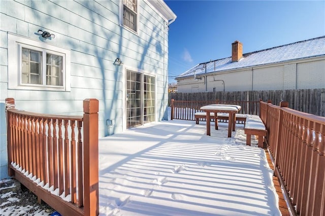 view of snow covered deck