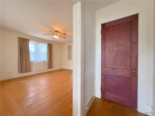 unfurnished room featuring hardwood / wood-style flooring and ceiling fan