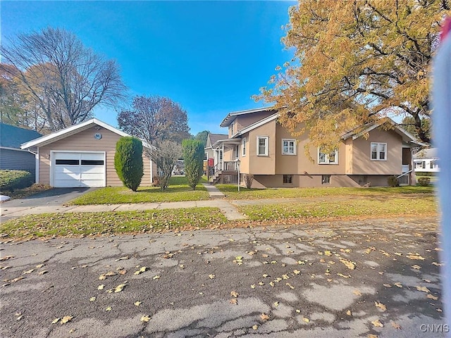 view of property exterior with a garage and an outdoor structure