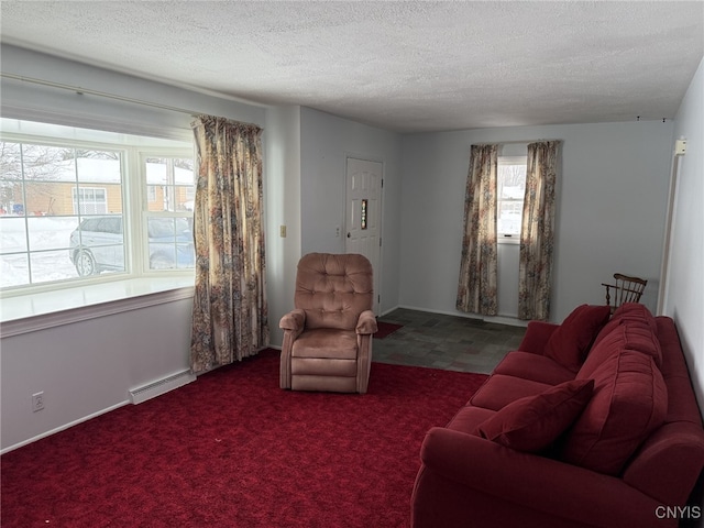 carpeted living room featuring a textured ceiling