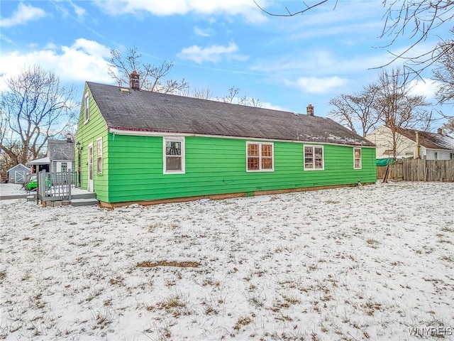 view of snow covered house