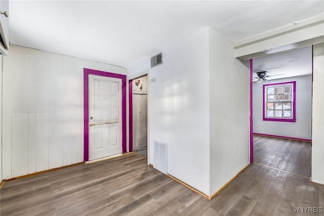 spare room with ceiling fan and dark wood-type flooring