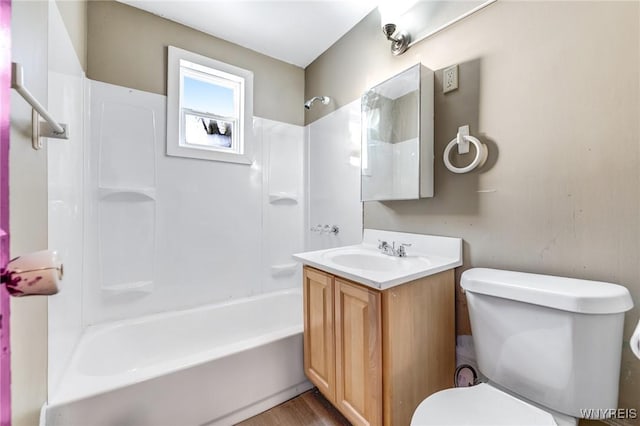 full bathroom with vanity,  shower combination, and toilet