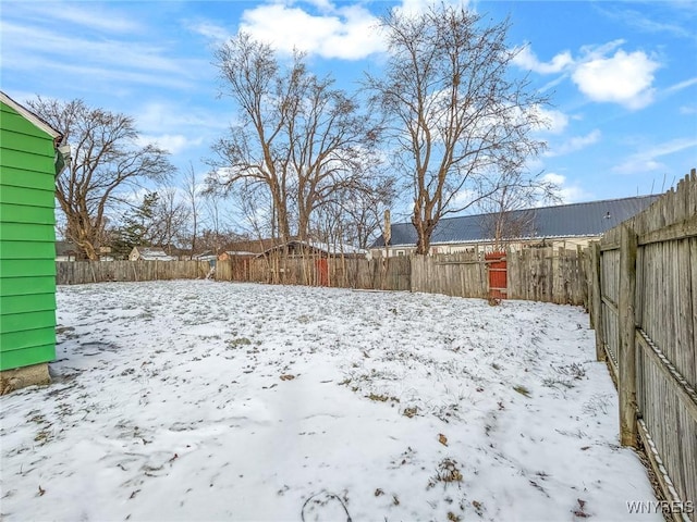 view of yard covered in snow