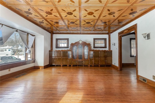 interior space featuring wood-type flooring and wooden ceiling