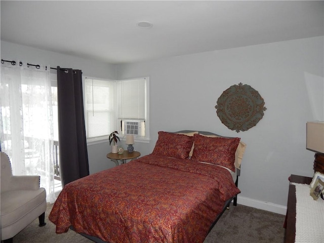 bedroom featuring cooling unit and dark colored carpet