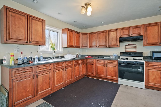 kitchen featuring white stove and sink