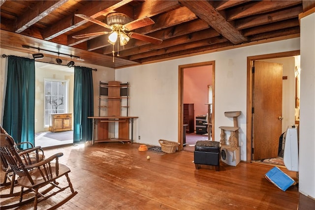 misc room featuring hardwood / wood-style flooring, ceiling fan, beam ceiling, and wood ceiling