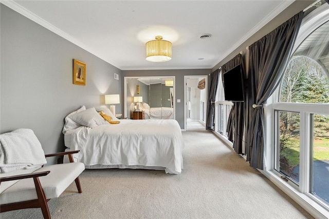 carpeted bedroom featuring multiple windows and ornamental molding