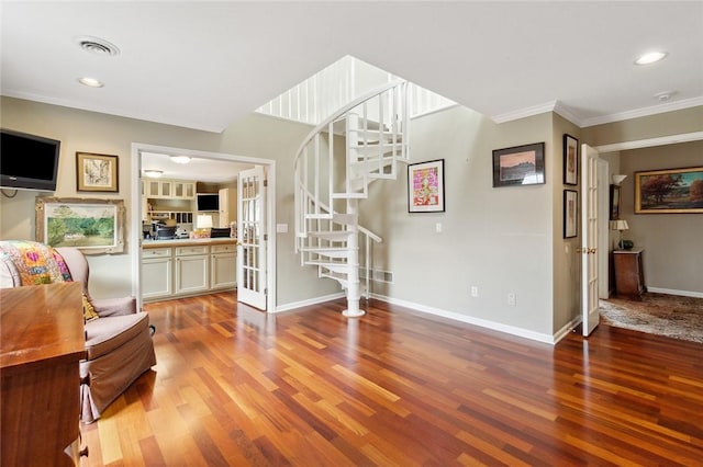 interior space featuring french doors, light wood-type flooring, and ornamental molding