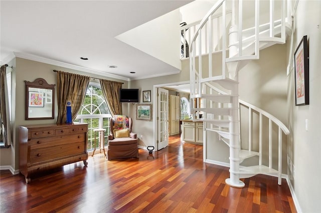 sitting room with crown molding, french doors, and hardwood / wood-style flooring