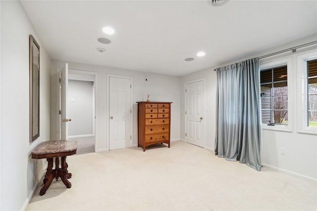 bedroom featuring light colored carpet