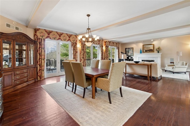 dining area featuring a notable chandelier, beam ceiling, ornamental molding, and dark wood-type flooring