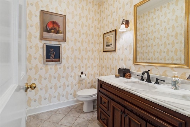 bathroom with tile patterned flooring, vanity, and toilet